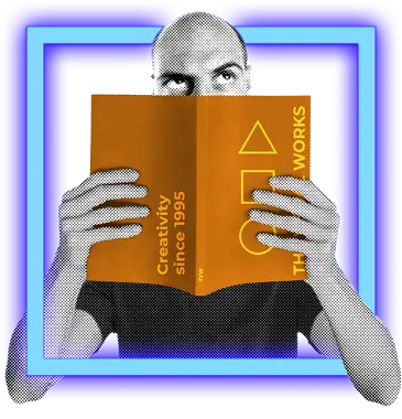a man in a blue neon square holding up a brochure to read signifying design